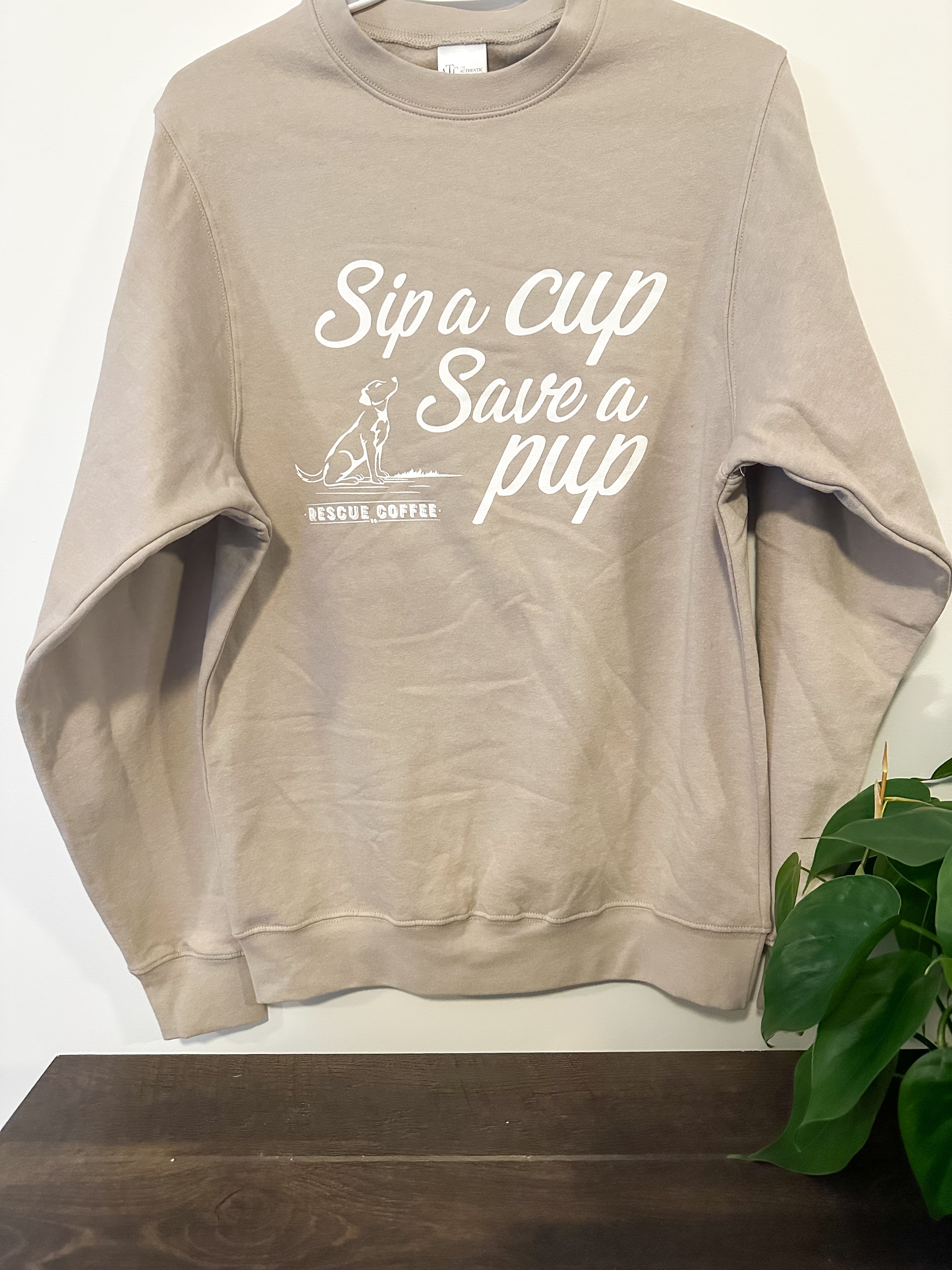Beige Rescue Coffee Branded Crewneck with slogan "Sip a Cup, Save a Pup"